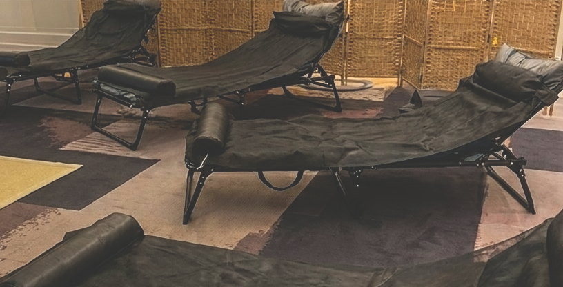 Reclining loungers in the candlelit community lounge